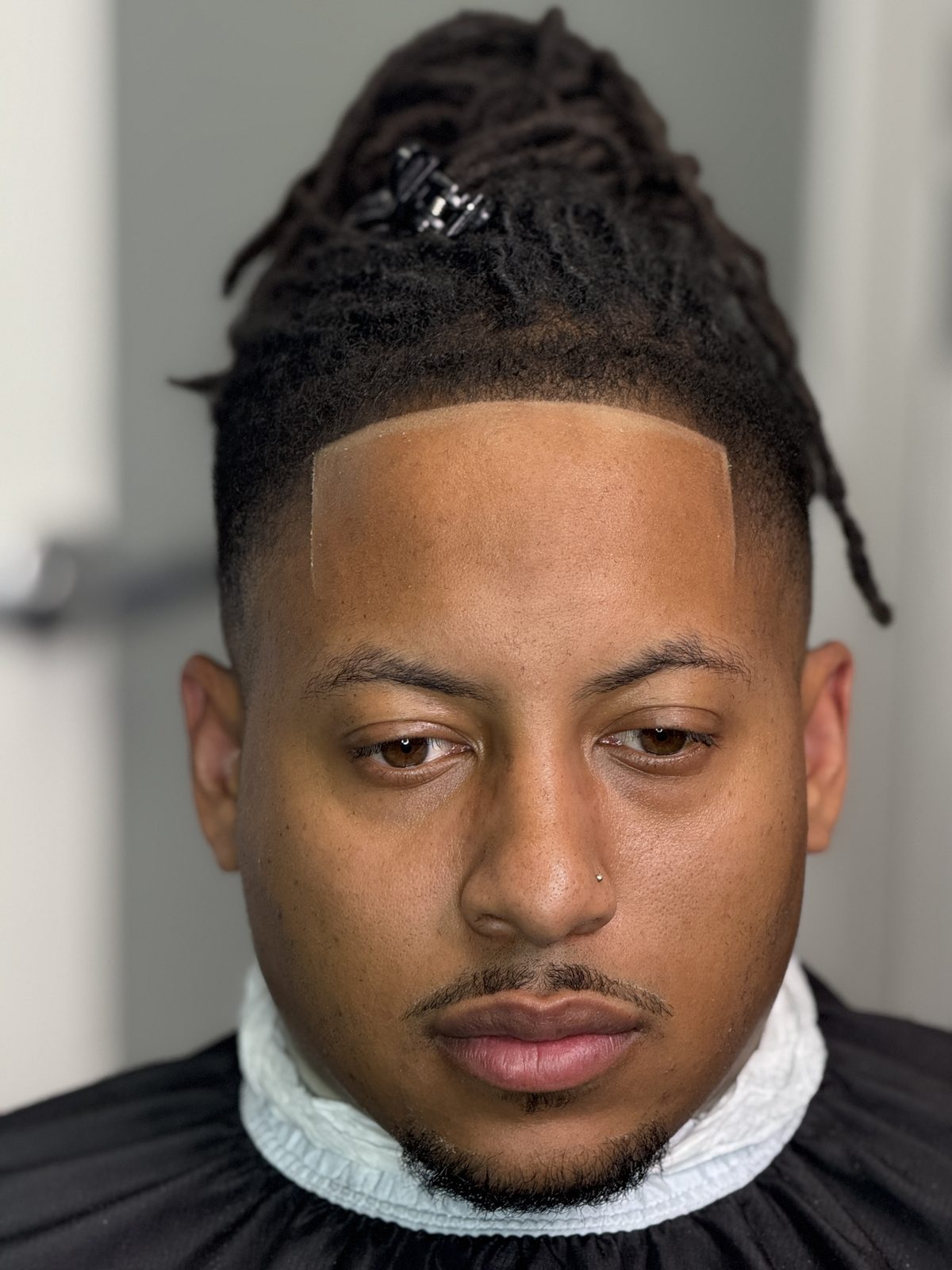Locs taper with sharp part by Larry The Barber